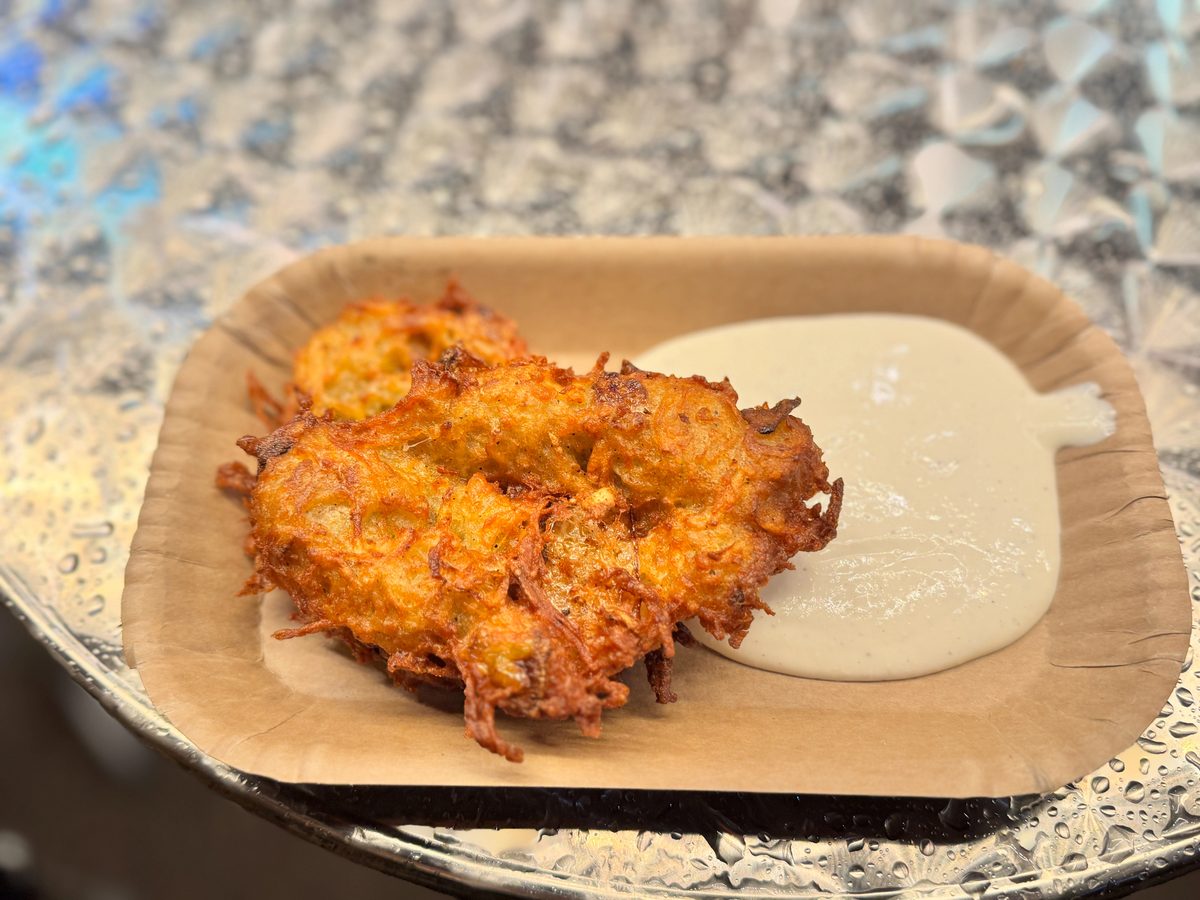Crispy Reibekuchen potato pancake served with apple sauce