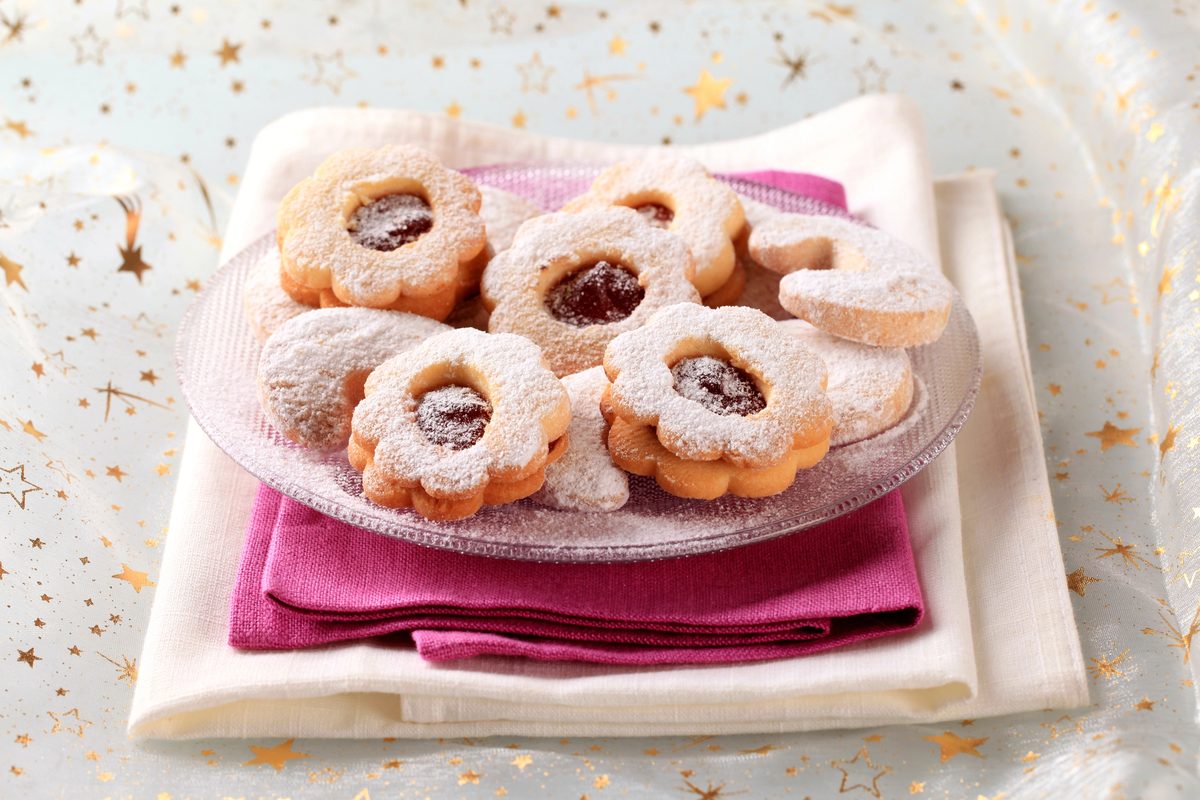Linzer jam sandwich cookies dusted with powdered sugar