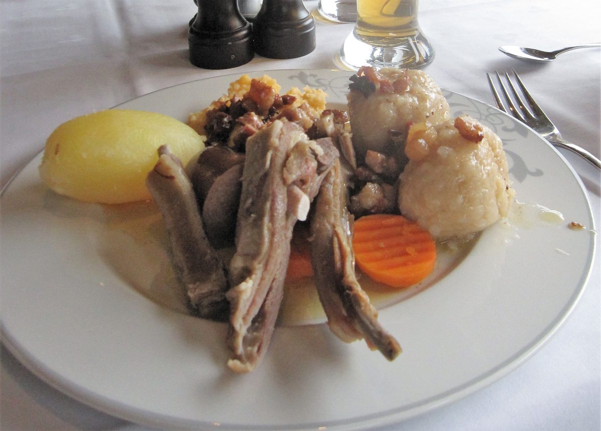 Pinnekjøtt, cured lamb ribs, with mashed rutabaga and potatoes on a plate