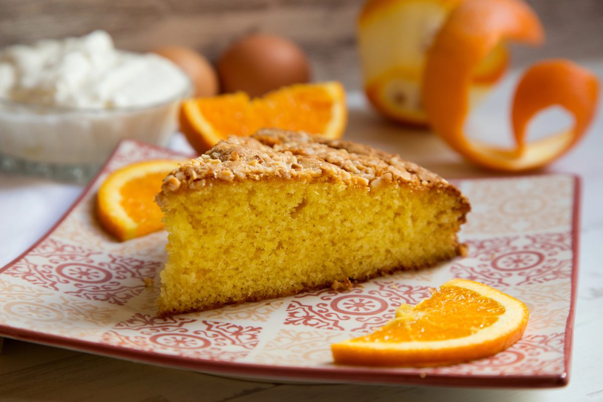Slice of orange sponge cake with orange slices