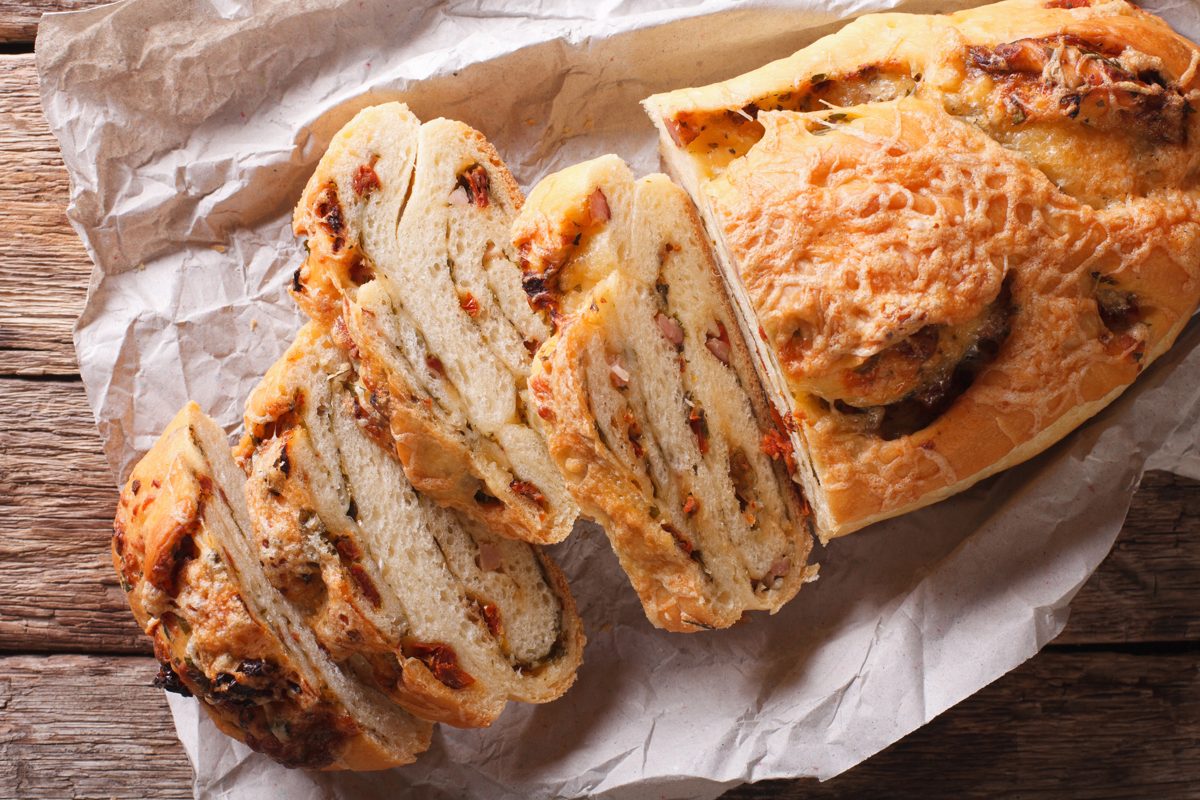 Sliced bread filled with cured meats