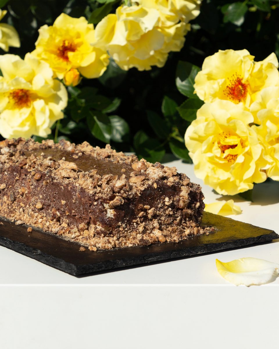 Reforma chocolate walnut cake with yellow flowers