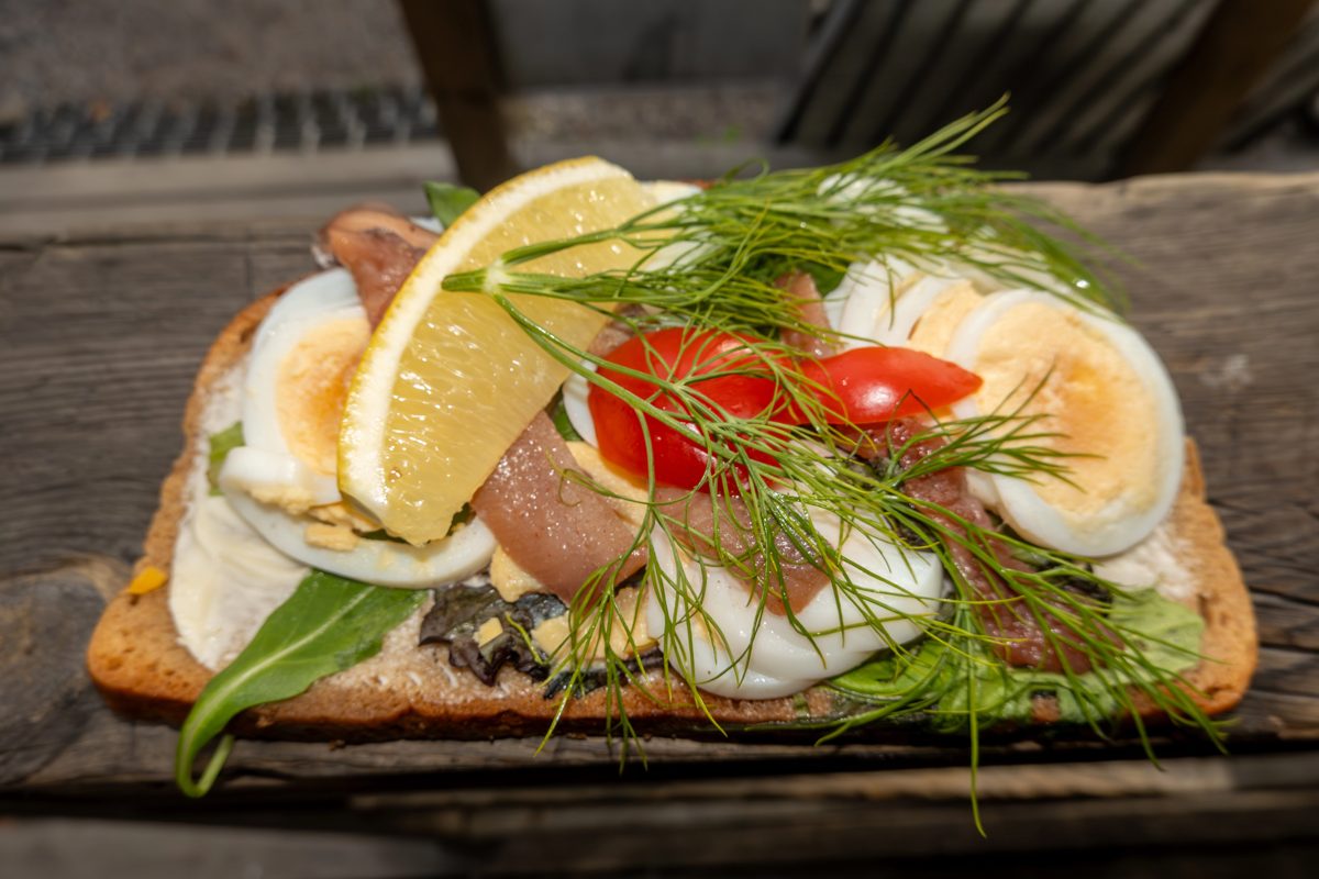 Open sandwich with egg, anchovy and dill