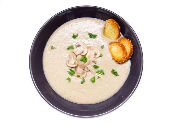Creamy mushroom soup on a white plate