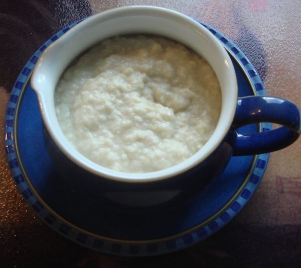 Bread sauce in a blue cup, a traditional accompaniment to Christmas roast