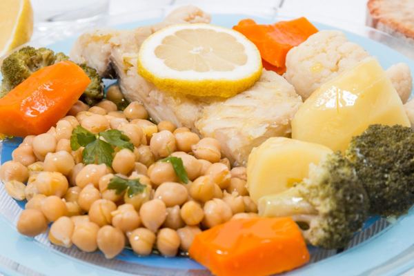 Salt cod with chickpeas, potatoes, carrots and boiled egg