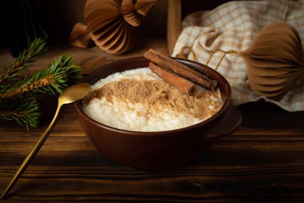 Christmas rice porridge with cinnamon in a ceramic bowl