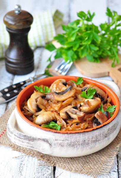 Braised cabbage with mushrooms in a ceramic dish