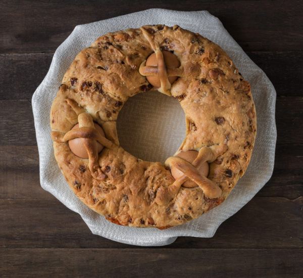 Ring-shaped casatiello Easter bread with eggs baked into the crust