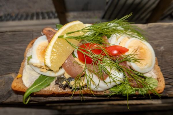 Open sandwich with egg, anchovy and dill