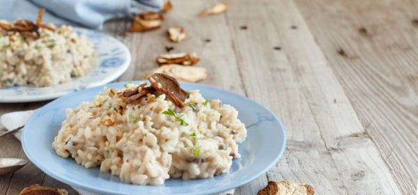 Porcini mushroom risotto on a blue plate