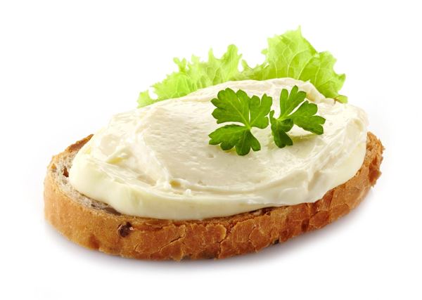Kajmak spread on slices of bread